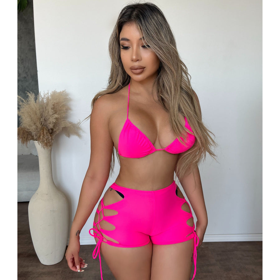 Model in a hot pink bikini set